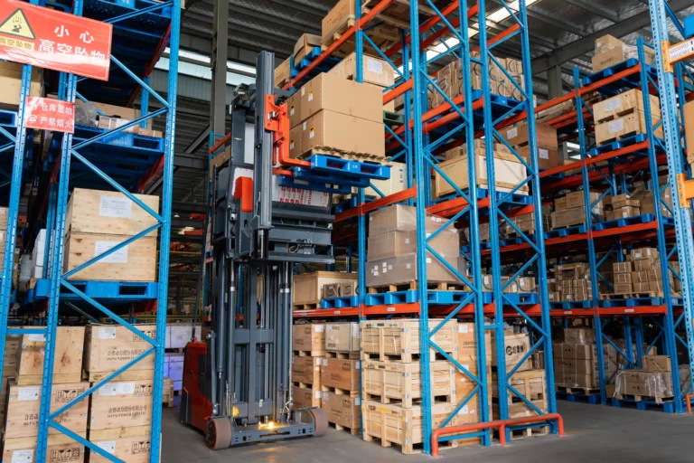 Man-Up Turret Truck operating in a high-rack VNA warehouse