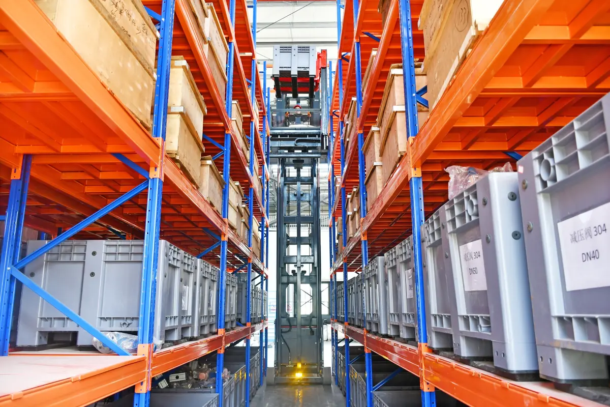 man-up turret truck working in a narrow aisle